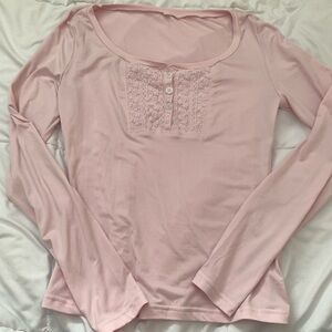 pink long sleeve top with detailing